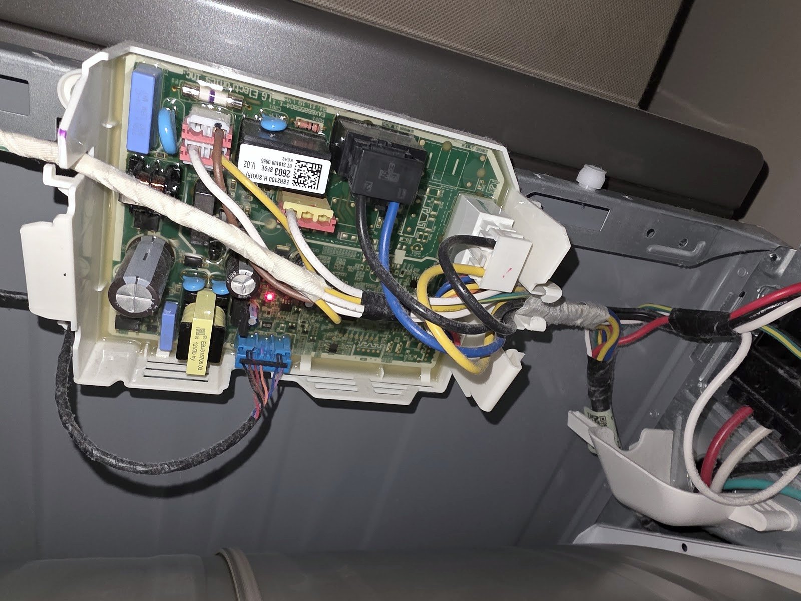Dishwasher electronic control board and wire connections exposed for inspection