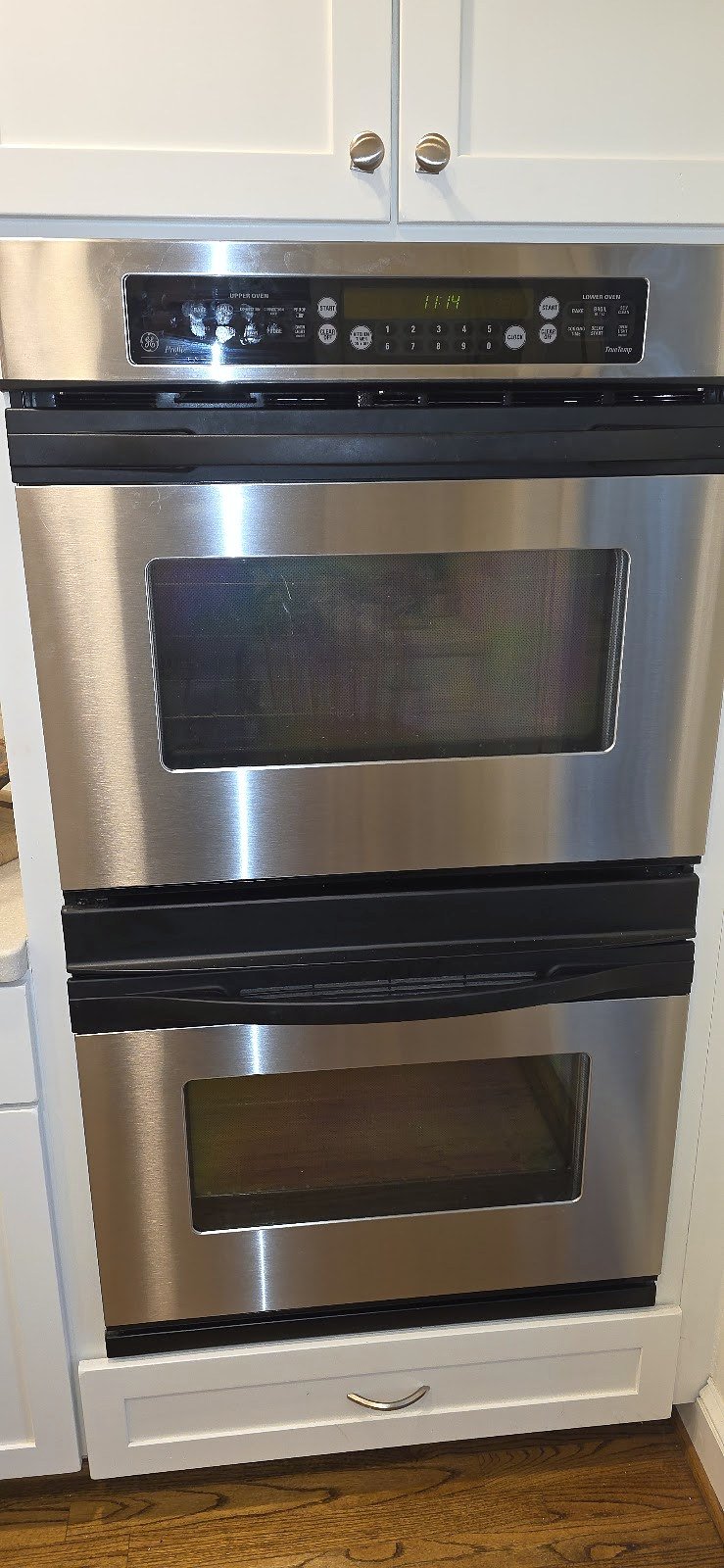 Stainless steel double wall oven installed in kitchen cabinetry