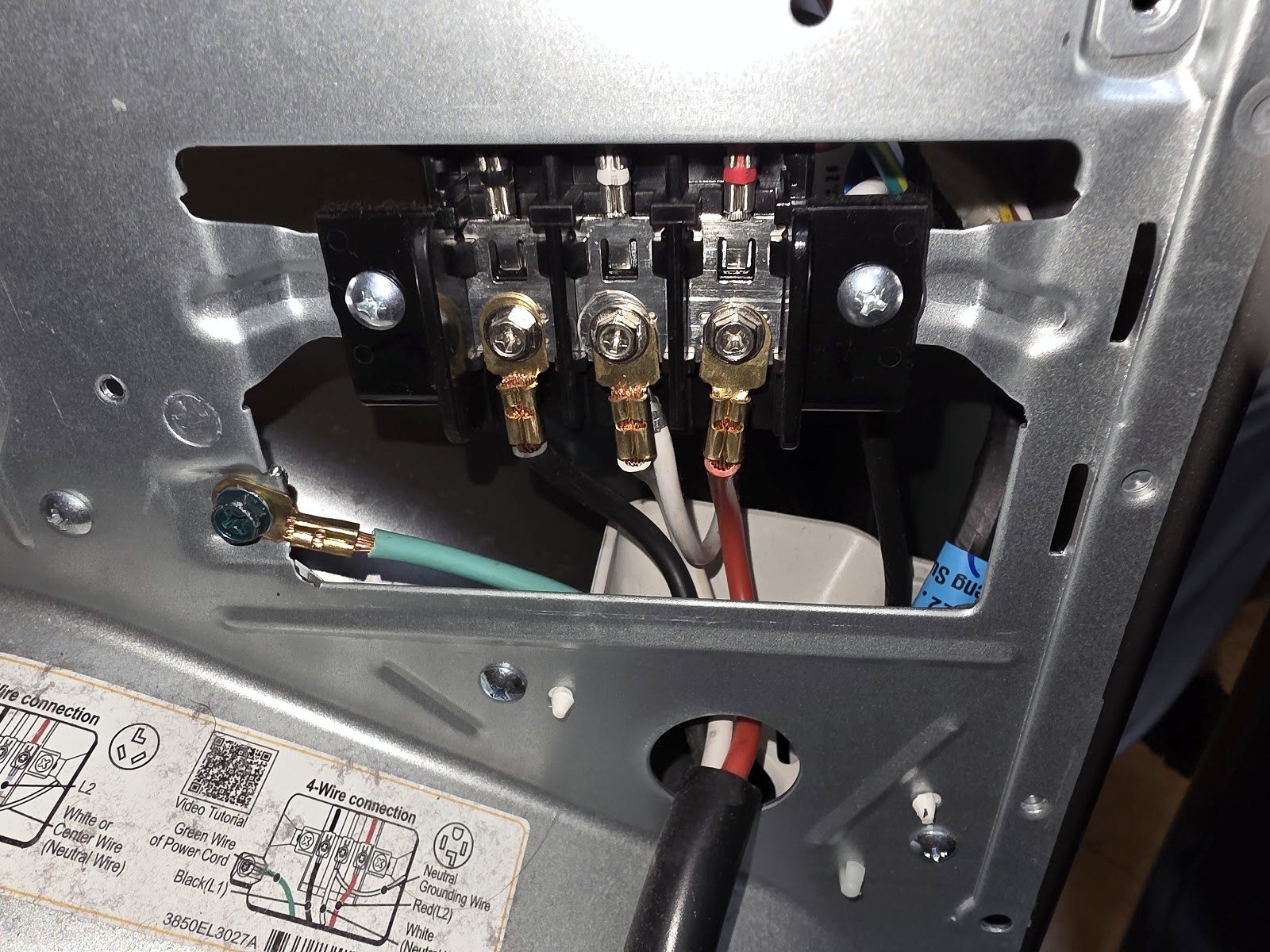 Dryer power-cord terminal block with its protective cover removed