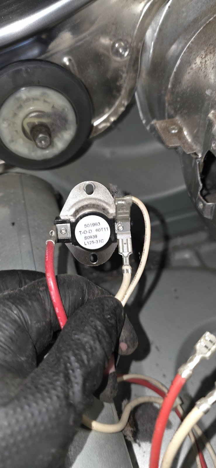 Meter probes connected to a small temperature-control component inside a dryer