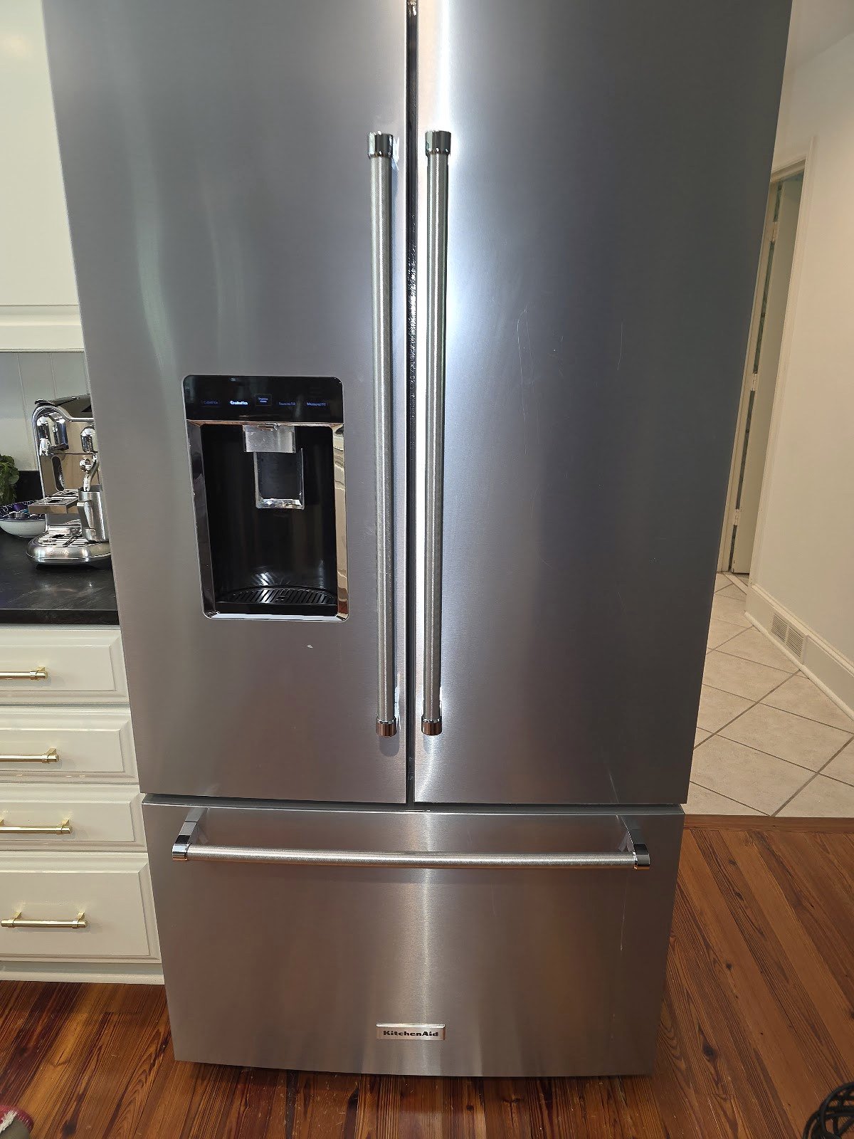 Stainless steel refrigerator with French doors and lower freezer drawers
