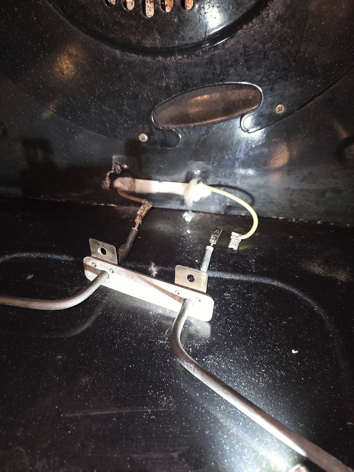 Gas oven ignition components and connecting wires inside an oven