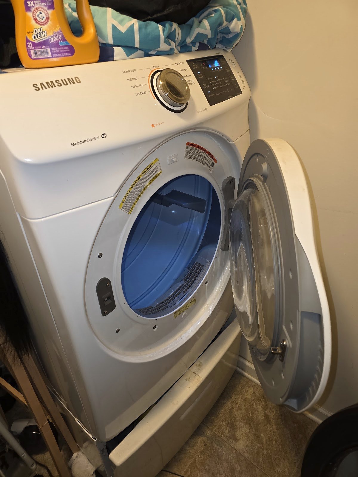 White Samsung dryer with its door open