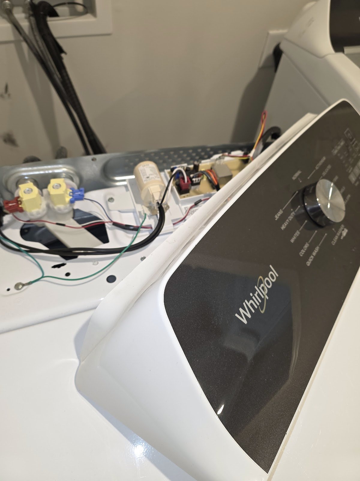 Open control console and wiring on a Whirlpool top-load washer