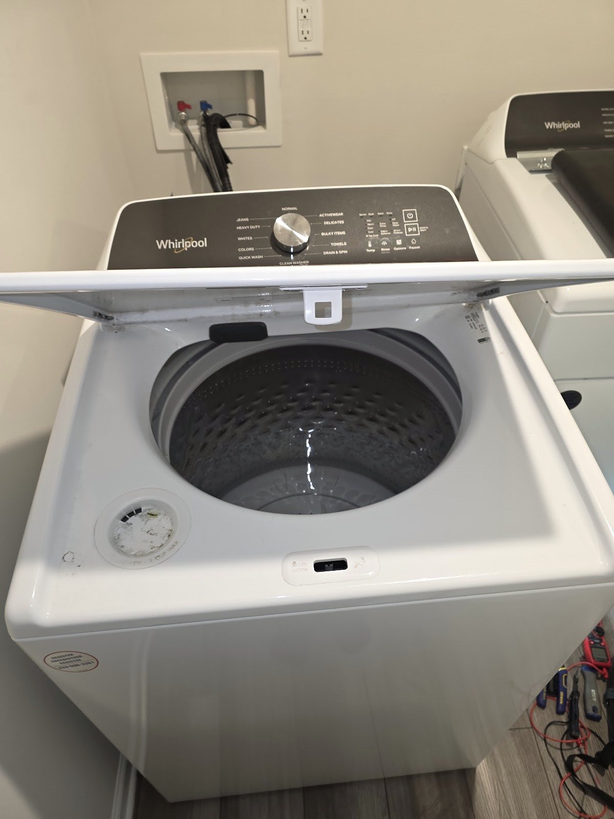 Whirlpool top-load washer with its lid open
